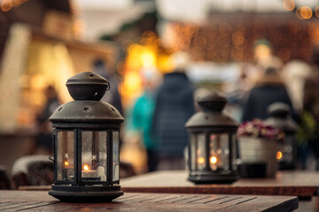 Fototapeta na wymiar two candle lanterns on outdoor coffee tables