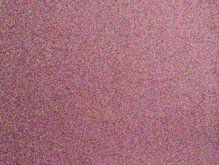 Fototapeta premium Pink glittery bright shimmering background use as a design backdrop. Defocused abstract pink twinkle light background.