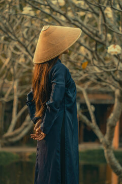 Beautiful Vietnam girl from Hue city, Vietnam who wearing Ao dai. Ao dai is famous traditional custume for woman in Vietnam. Vintage style,travel and relaxing concept.
