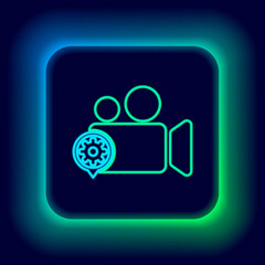 Glowing neon line Movie or Video camera and gear icon isolated on black background. Adjusting app, service concept, setting options, maintenance, repair, fixing. Colorful outline concept. Vector.
