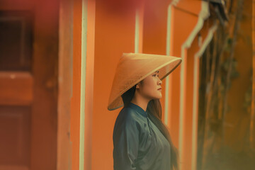 Beautiful Vietnam girl from Hue city, Vietnam who wearing Ao dai. Ao dai is famous traditional...