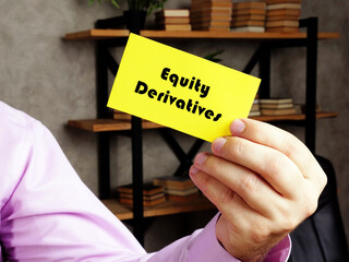 Business concept about Equity Derivatives with inscription on the yelow business card.