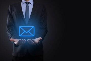 Businessman hand holding e-mail icon, Contact us by newsletter email and protect your personal...