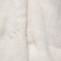 Light fur on a fur coat. Shiny, expensive pattern with textured hairs