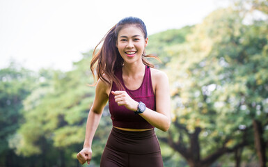 Asian woman is warm up, To make the muscles flexible Before going to jogging for good health and energy metabolism,Outdoors cross training workout. Healthcare concept