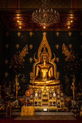 Budhha golden statue isolated in Buddhist monastery