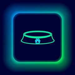 Glowing neon line Pet food bowl for cat or dog icon isolated on black background. Dog or cat paw print. Colorful outline concept. Vector.