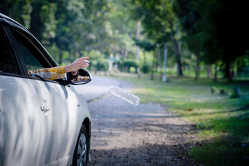 Woman hand picking up garbage plastic for cleaning at park