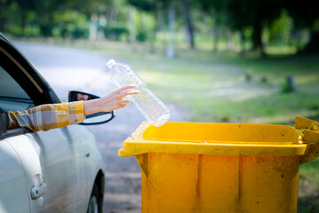 Woman hand picking up garbage plastic for cleaning at park