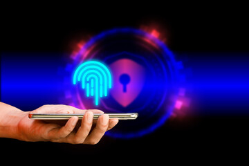 Fingerprint and security concept. Hand holding mobile or smartphone with virtual fingerprint and...