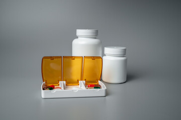 Pills and capsules in pill organizer. Medical Concept, Illustration of Pharmacy Bag with Pill...
