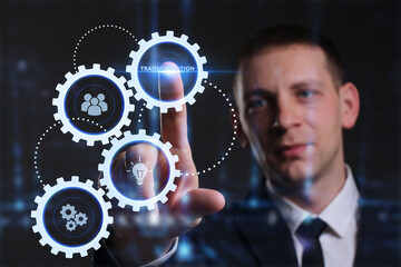Business, Technology, Internet and network concept. Young businessman working on a virtual screen of the future and sees the inscription: Transformation