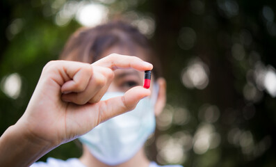 Close up of woman putting pill in mouth. Sick female taking medicines, antidepressant, painkiller...