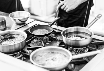 Chef cooking in a kitchen, chef at work, Black and White.