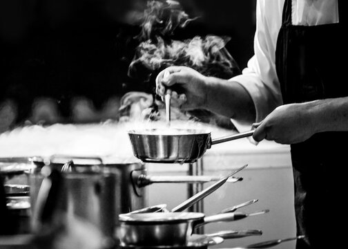 Chef cooking in a kitchen, chef at work, Black and White.