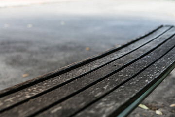 old bench on the asphalt in the park