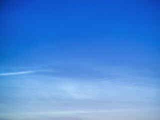 Fototapeta premium White Spindrift clouds on blue sky