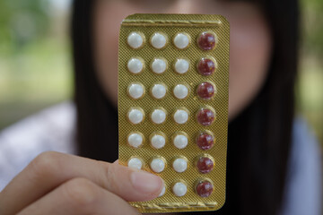 Close up of woman putting pill in mouth. Sick female taking medicines, antidepressant, painkiller...