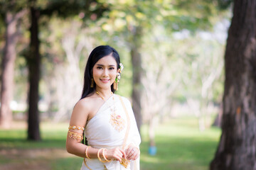 Asian Young women, Portrait of a beautiful thai woman wearing a thai dress,Smile with happiness.