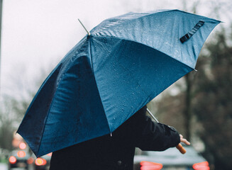 close up of man holding umbrella © Stadtrandfoto