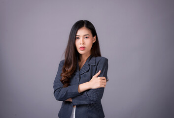 Portrait of Asian woman, happy working day.beautiful modern businesswoman ,holding tablet computer on Gray background in the studio