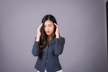 Portrait of Asian woman, happy working day.beautiful modern businesswoman ,holding tablet computer on Gray background in the studio