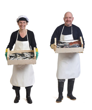 full portrait of a fishmongers couple holding fish and seafoods on white background
