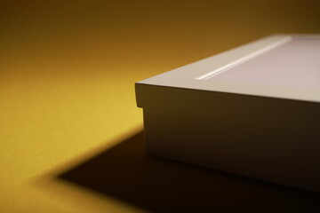 detail of flat led lamp on yellow background