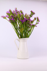 Fototapeta na wymiar a bouquet of purple statice flower on white background