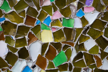 evocative image of mosaic texture of irregularly shaped tiles of various colors
