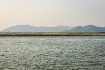 river island with mountain backdrop at dusk