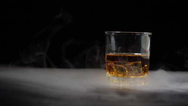 Whiskey glass on black background beautiful