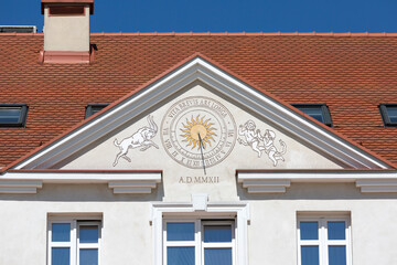 Sundial on the facade of a tenement house in the market square, Rzeszow, Poland