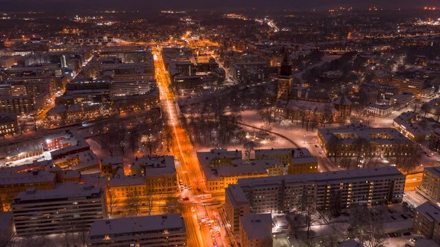 Aerial time-lapse of the city skyline and Turku Cathedral in Turku, Finland in winter