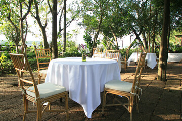 Table setting with chairs for garden banquet