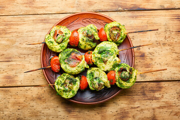 Chicken skewers on rustic wooden table