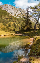 Beautiful alpine summer view with reflections in a lake at the famous Tauplitzalm, Salzkammergut, Steiermark, Austria