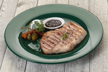 Grilled pork steak with pepper sauce