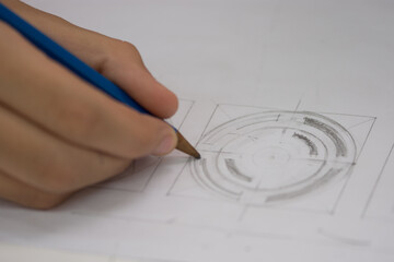 hand drawing a pencil