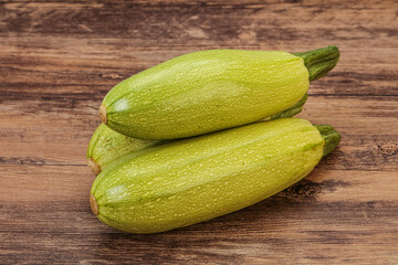 Young tasty zucchini over board