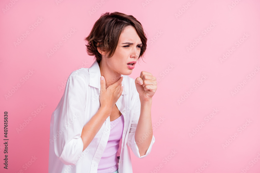 Poster photo of sad unhealthy young lady wear white shirt coughing fist arm neck isolated pastel pink color