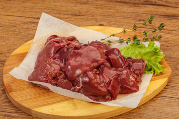 Raw chicken liver over board