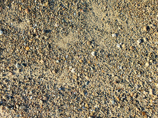 Pebble texture. Sand gravel mixture (ASG) for road cushion. Top view