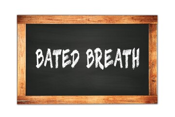 Fototapeta premium BATED BREATH text written on wooden frame school blackboard.