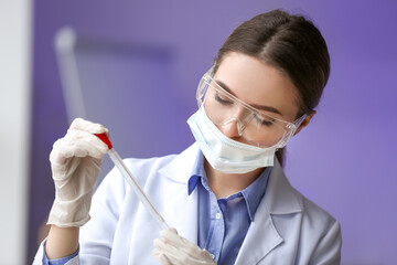 Scientist with sample of covid-19 in laboratory