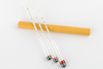 device for measuring the degree of alcohol in a distillery on a white background