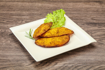 Baked potato with herbs and spices