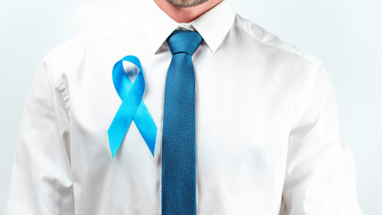 November. Hipster men in bright shirt, cyan tie with blue ribbon in hands on white background....