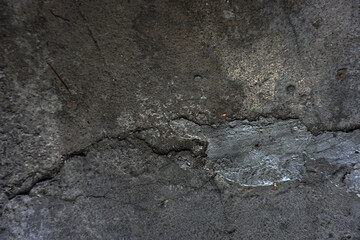 The shadow of the old gray cement wall surface with cracks    