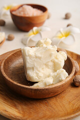 Plate with shea butter on table